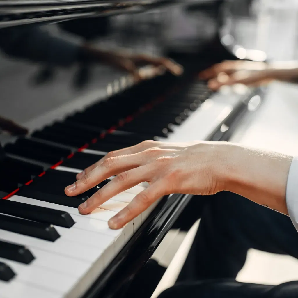 Music student practising on piano